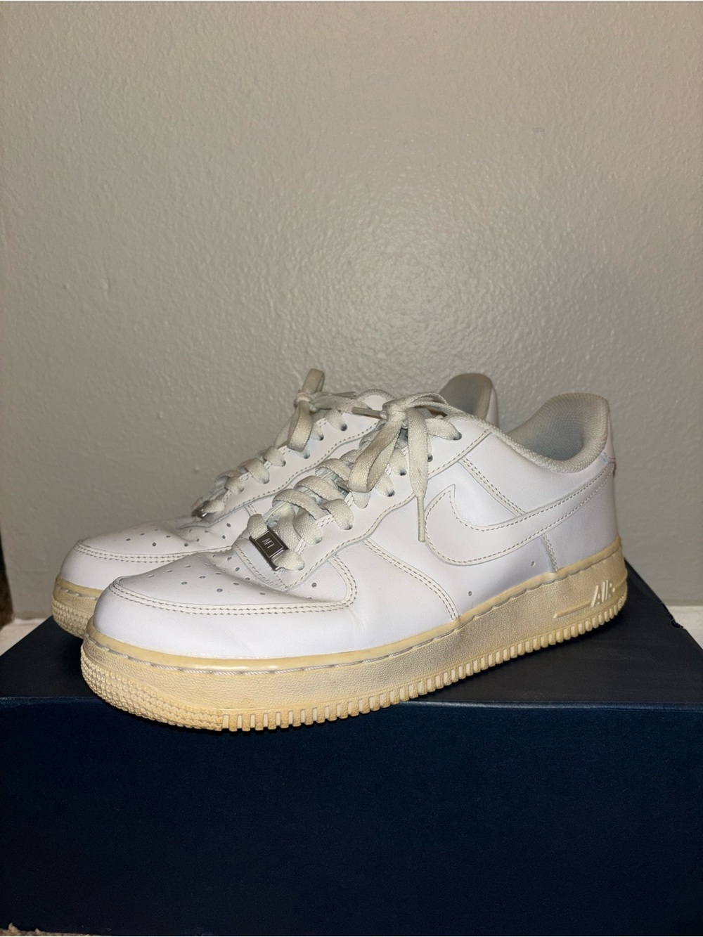Nike Air Force 1 White Leather Sneakers with Yellowed Cream Sole